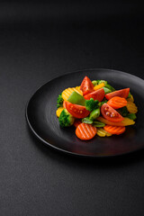 Salad of fresh and steamed vegetables cherry tomatoes, broccoli and carrots