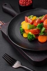 Salad of fresh and steamed vegetables cherry tomatoes, broccoli and carrots