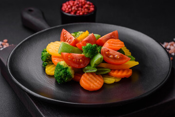Salad of fresh and steamed vegetables cherry tomatoes, broccoli and carrots