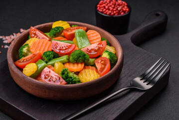 Salad of fresh and steamed vegetables cherry tomatoes, broccoli and carrots