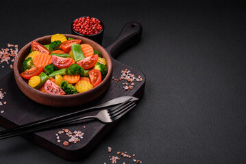 Salad of fresh and steamed vegetables cherry tomatoes, broccoli and carrots
