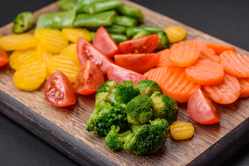 Salad of fresh and steamed vegetables cherry tomatoes, broccoli and carrots
