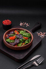 Salad of fresh cherry tomatoes, arugula, spinach and young beet leaves