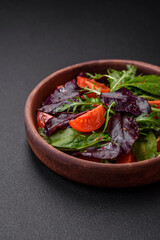 Salad of fresh cherry tomatoes, arugula, spinach and young beet leaves