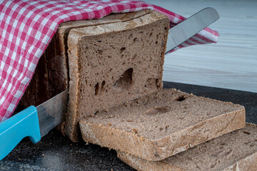 Gluten-free rectangular bread loaves. It is made with buckwheat flour, black cumin powder, gluten-free baking powder, water and salt. Gluten free food.