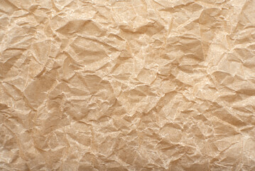 Texture of crumpled baking paper. Background from old retro paper