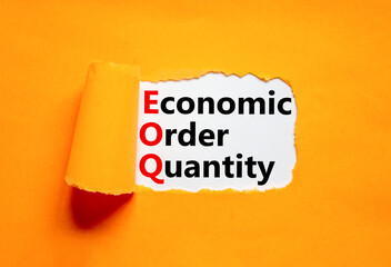 EOQ economic order quantity symbol. Concept words EOQ economic order quantity on white paper on a beautiful orange background. Business EOQ economic order quantity concept. Copy space.