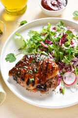 Roasted pork steak with salad from fresh vegetable
