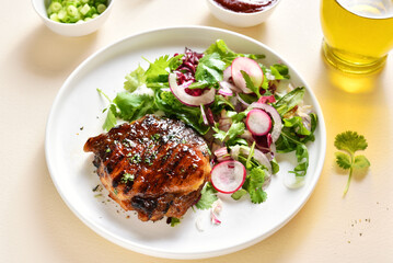 Roasted pork steak with salad from fresh vegetable