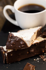 Fresh sweet cake with milk taste and aroma in chocolate glaze