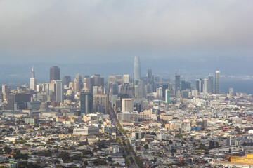 Fototapeta na wymiar Aerial views of San Francisos cityscape in its classic fog.