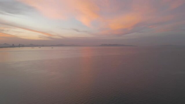 Aerial view of Pattaya sea, beach in Thailand in summer season, urban city with blue sky for travel background. Chon buri skyline.