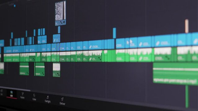 Close up of video editing time line and computer monitor as video editor works on edit Video editing on computer. fix work of program for video editing, video processing, post-production, clip maker