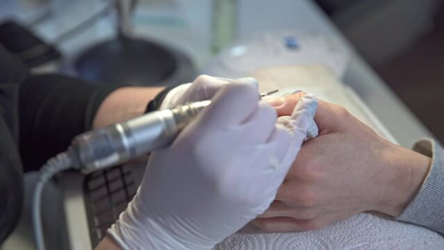 zooming in on the hands of a woman using beauty salon services