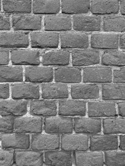 black and white photo of brick wall