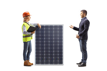 Casual man talking to a female engineer with a solar panel