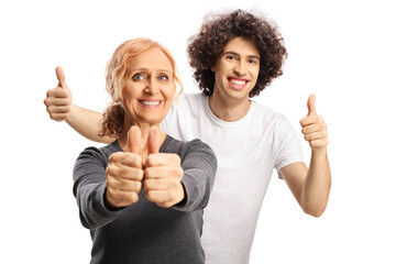 Guy with curly hair and a mature woman smiling and gesturing thumbs up
