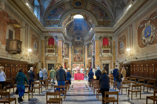 Mass at Oratorio di San Francesco Saverio (oratorio del Caravita) baroque styled church in the Pigna district of Rome, Italy
