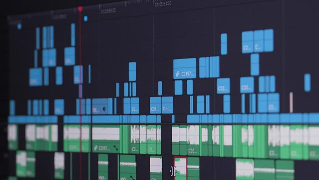 Close up of video editing time line and computer monitor as video editor works on edit Video editing on computer. fix work of program for video editing, video processing, post-production, clip maker