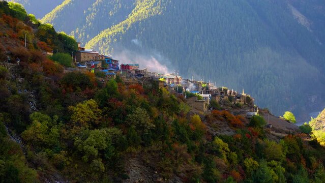 Parallax of the small picturesque Nepalese village of Upper Pisang at sunrise in the Annapurna mountain range, Nepal