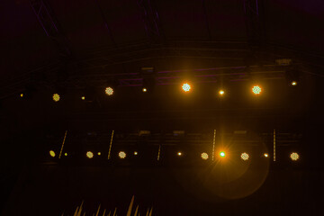 yellow stage lights with smoke on concert. Background in show. Interior shined with a projector....