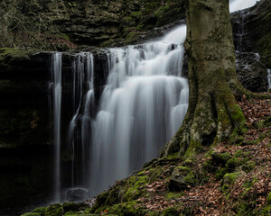Beautiful peaceful landscape image of Scaleber Force waterfall in Yorkshire Dales in England during Winter morning