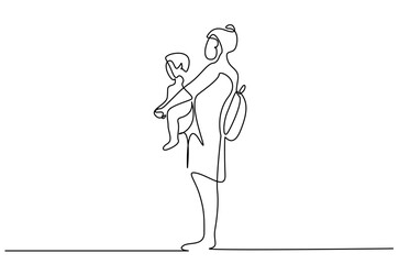 mother carrying child in her arms standing outside waiting