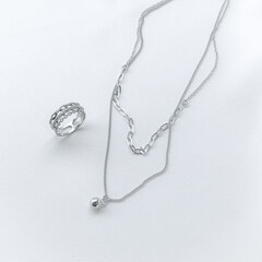 Stylish silver necklace and ring.