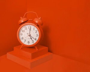 Red vintage old alarm clock or watch with monochromatic blocks and background, wood and layers for morning wake up motivation with space for copy social media blog article linkedin 