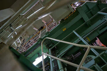 Ship's engine room. Vessel's ( Ship ) Engine Room Space / industrial stairs. Ship's Engine Heavy Machinery Space - Pipes, Valves, Engines