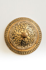 directly above view of vintage brass hotel service concierge bell