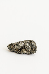 sparkling pyrite, fool's gold crystal geode rock on white