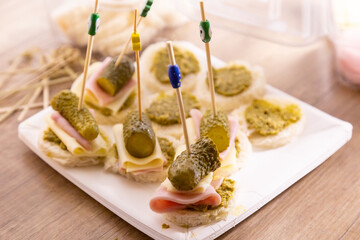 Canape on skewers with ham and cheese, breakfast, sunny morning light