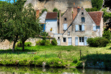 Fototapeta na wymiar Buildings by River Indrois in Beautiful Montresor, Loire, France