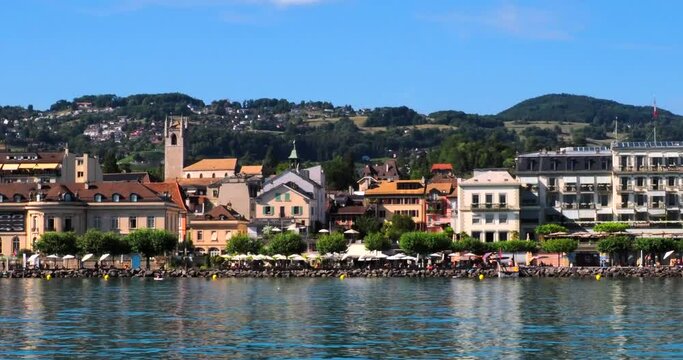 Vevey, Switzerland - July 14, 2022: View from a tourist boat on Lake Geneva passing Vevey near Lausanne