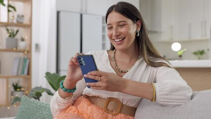 Woman, smartphone and laughing on couch, lounge and reading funny social media post, online chat and meme. Happy female typing on cellphone in house, smile and mobile download with technology - Powered by Adobe