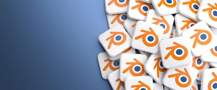 Logos of the 3d modeling and rendering software blender on a heap on a table.