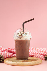 Ice coffee with cream on table. Caramel frappe coffee in the coffee shop.