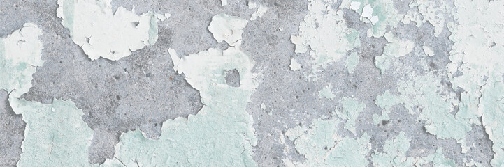 Peeling paint on the wall. Old concrete wall with cracked flaking paint. Weathered rough painted surface with patterns of cracks and peeling. Grunge texture for background and design. High resolution.