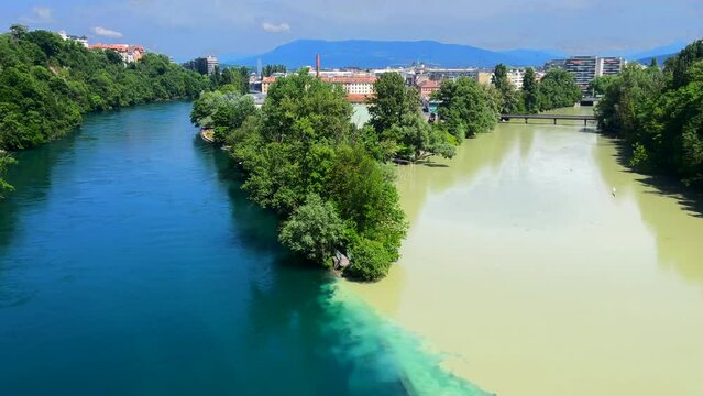 Famous La Jonction, the joint and confluence of rivers Rhone on the left and Arve on the right in Geneva, Switzerland.