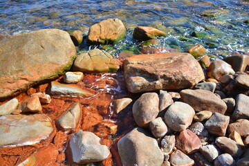 Fototapeta na wymiar Red water from the hot spring of Ikaria