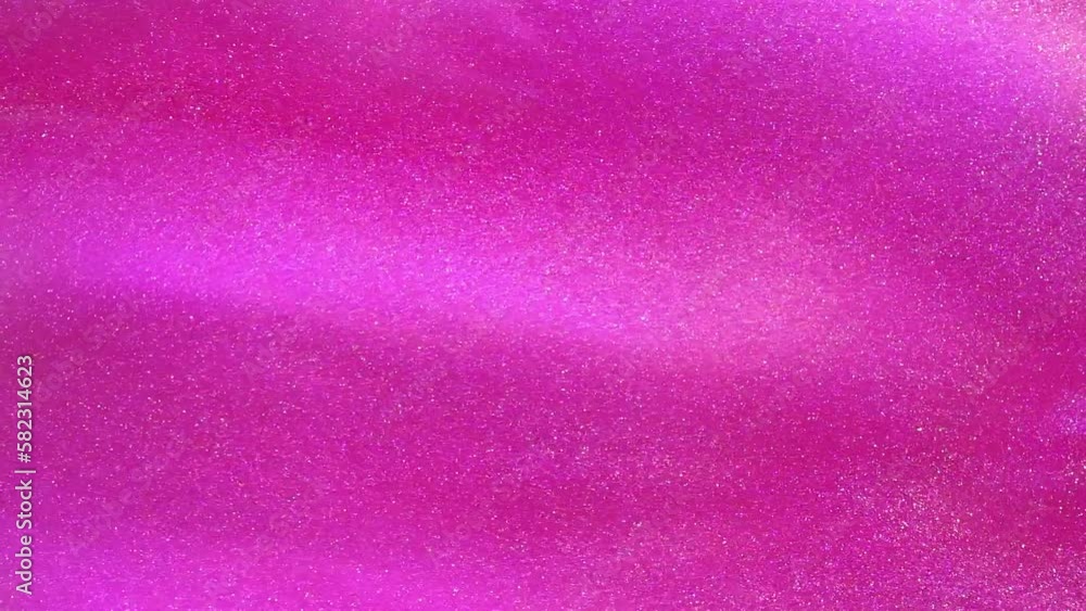 Wall mural white dust particles float slowly in a pink liquid. abstract girly moving background. white glitter 