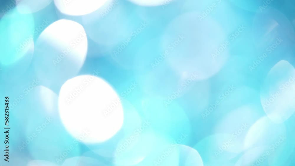 Wall mural blue and white bokeh circular motion background. abstract movement of light blue defocused circles a