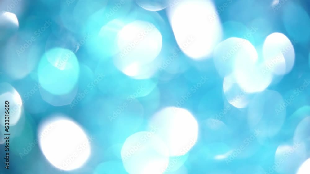 Sticker circular motion of blue and white bokeh. smooth bokeh in light colors moving background. blue and wh