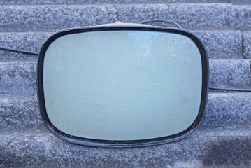 one old glass kinescope from a retro TV lies on a gray table on the street