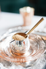 sugar in a silver jar with silver spoon for an elegant english tea party 