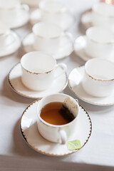 cups and saucers with tea at a wedding party refreshments