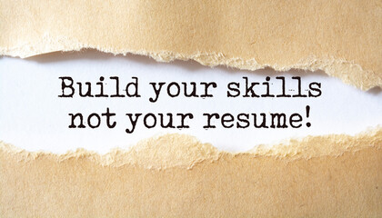 Build your skills not your resume. Words written under torn paper.