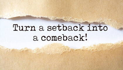 Turn a setback into a comeback. Words written under torn paper. Motivation concept text.