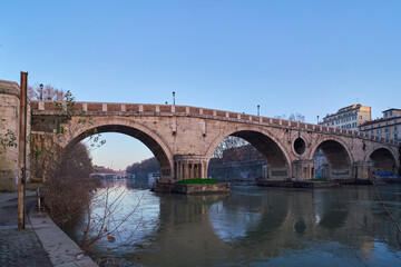 Early morning view of Ponte Sisto from below, a bridge of river Tiber in Rome, Italy